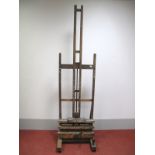 A XIX Century Oak and Pine Artists Easel, with wind-out action, on block supports with ceramic