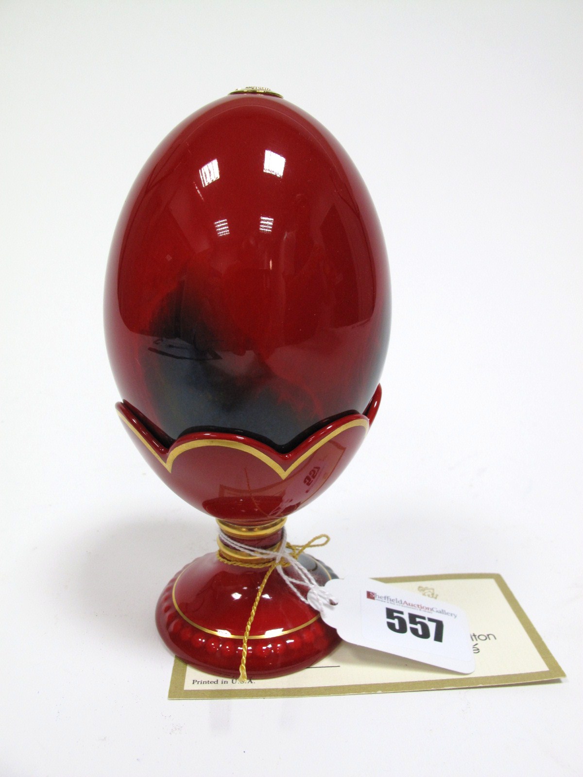 A Royal Doulton Limited Edition Flambé Egg and Stand, with certificate no. 2836/3500, 14cms high.