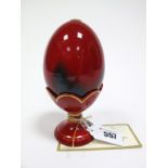 A Royal Doulton Limited Edition Flambé Egg and Stand, with certificate no. 2836/3500, 14cms high.