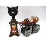 Spirits - Two Bottles of Southern Comfort, 70cl, in novelty cat and fire engine bottle holders.