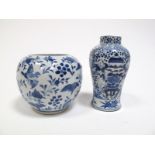 A Chinese Porcelain Baluster Vase, blue and white painted with figures and vases on an intense