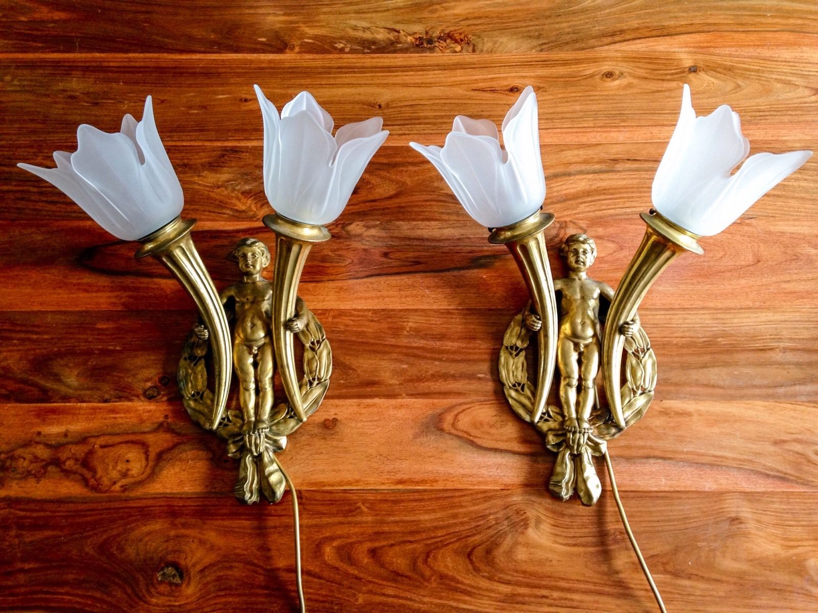 A Pair of XX Century Brass Wall Light Brackets, each as a ribbon tied laurel wreath, supporting an