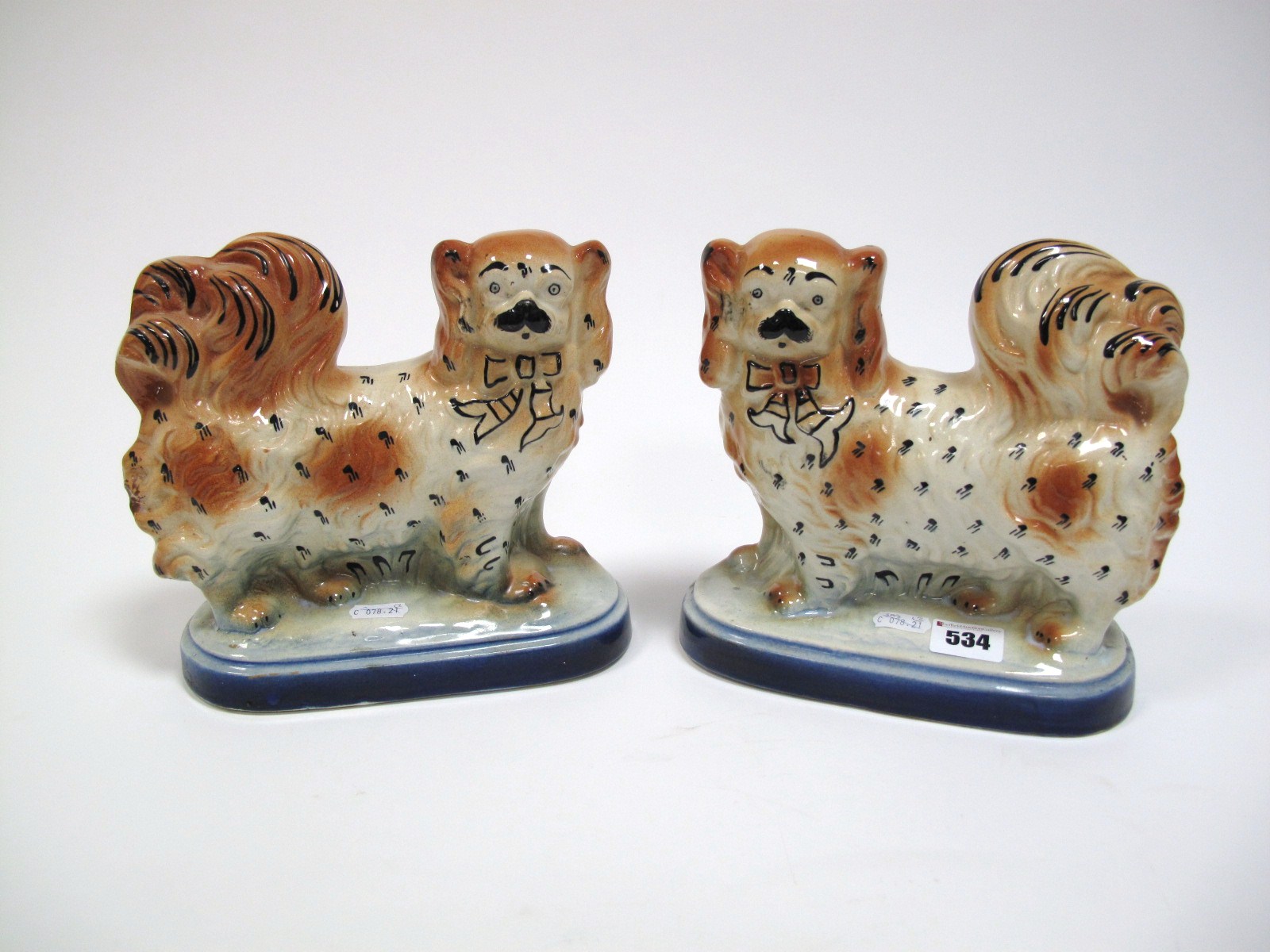 A Pair of XIX Century Staffordshire Pottery Pekingese Type Standing Dogs, each with black neck