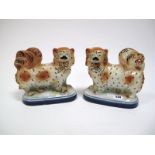 A Pair of XIX Century Staffordshire Pottery Pekingese Type Standing Dogs, each with black neck