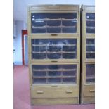 An Early - Mid XX Century Light Oak Haberdashery Shop Display Cabinet, bearing makers label "