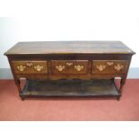 A Mid XVIII Century Joined Oak Dresser Base, with three small drawers, shaped apron on turned and