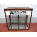 A XX Century Mahogany Shop Counter Display Cabinet, advertising "Kemps Pharmacy Ltd. Chemists and