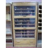 An Early - Mid XX Century Light Oak Haberdashery Shop Display Cabinet, bearing makers label "