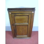 A Late XVIII Century Oak Flat Fronted Corner Cupboard, with reeded frieze over a double panelled