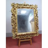 A Late XIX Century Large Gilt Gesso Wall Mirror, of rectangular form, heavily decorated with