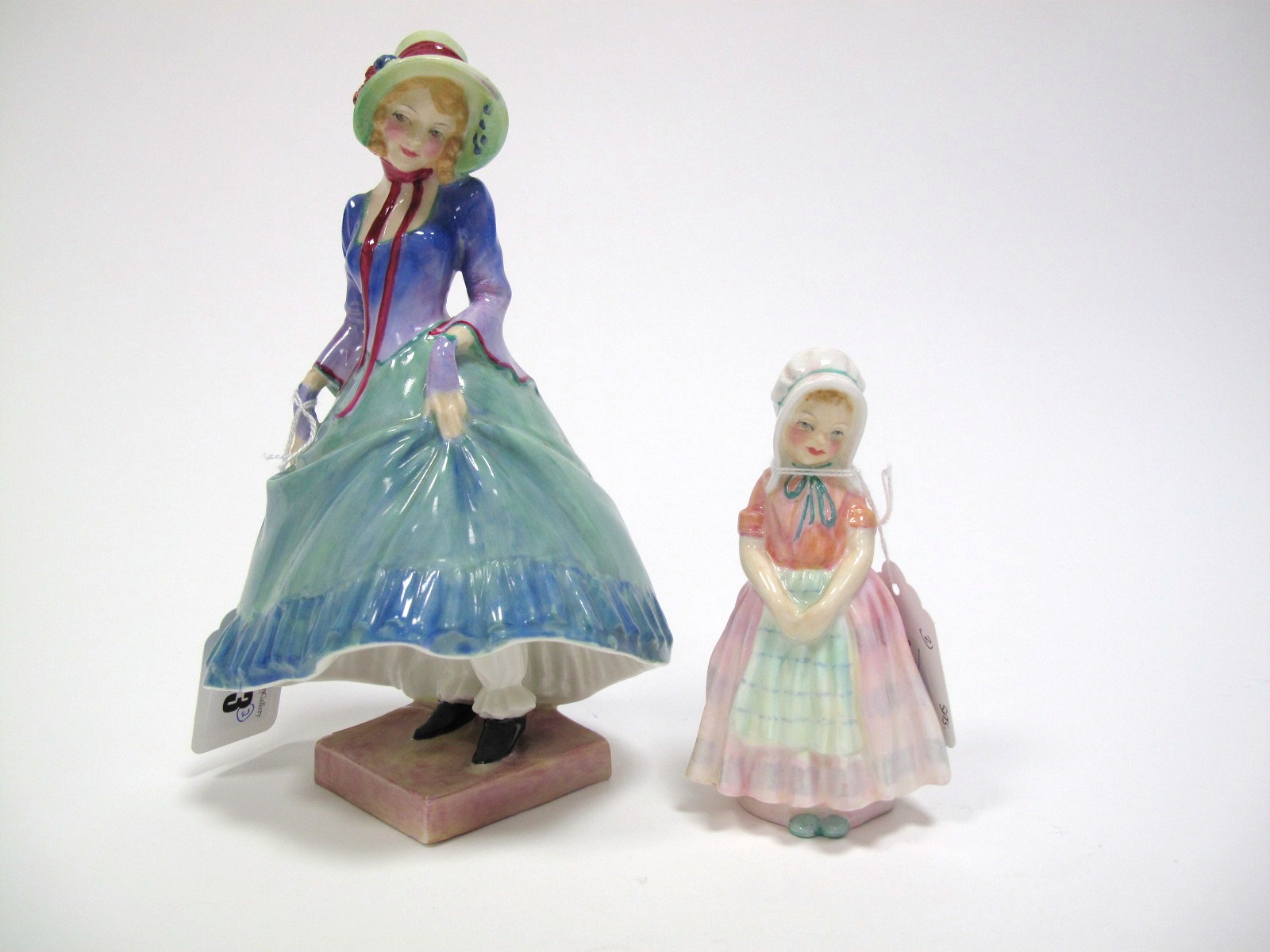 A Royal Doulton Figure "Pantalette", HN1362, designed by L. Harradine, with green skirt and blue