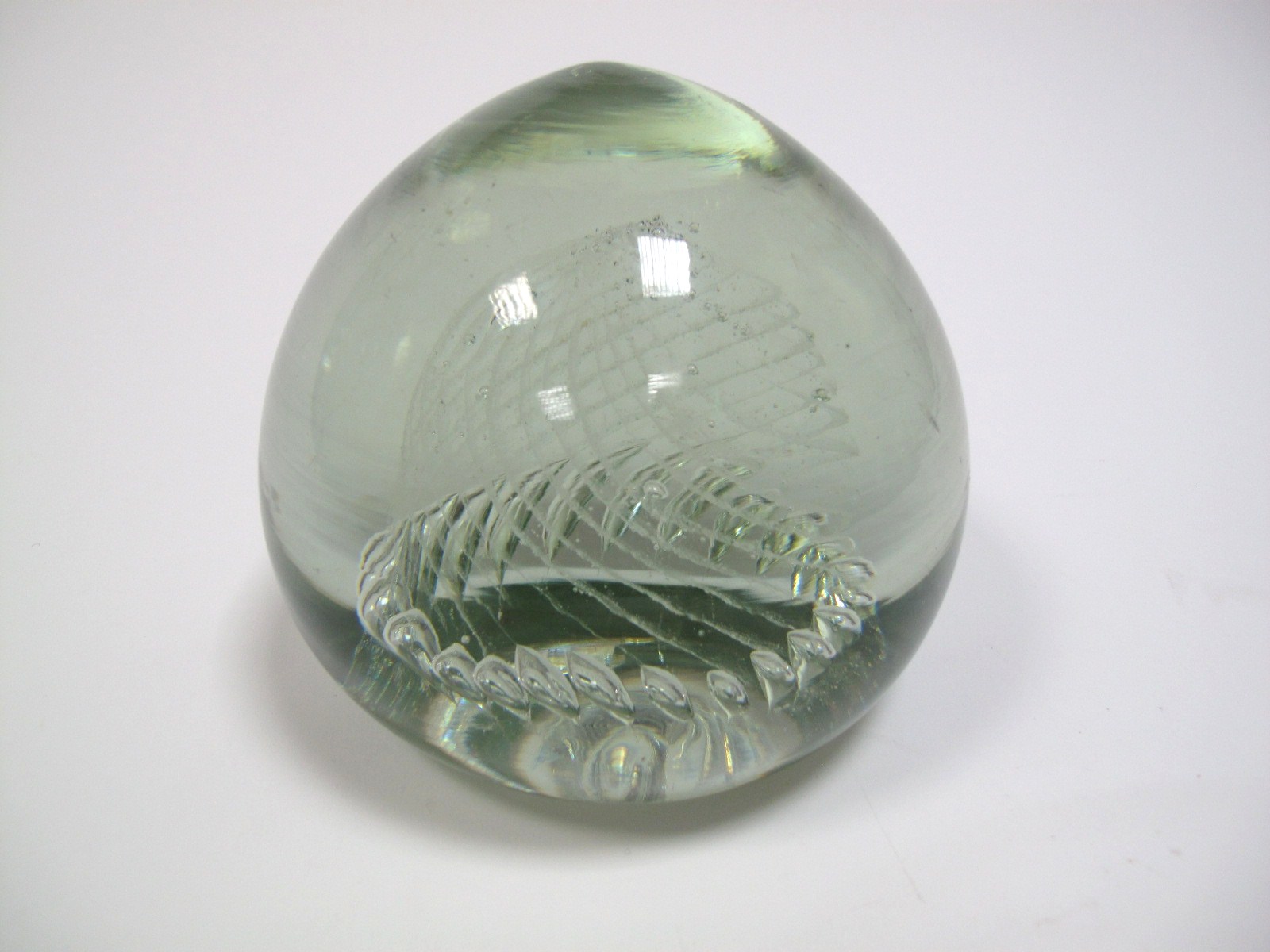 A Victorian Glass Dump, of globular form inset with spiral bubble inclusions, 13cms high, 13.5cms