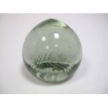 A Victorian Glass Dump, of globular form inset with spiral bubble inclusions, 13cms high, 13.5cms