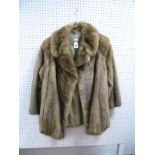 A Ladies Mink Jacket, in mid brown, with rever collar, 76cms long.
