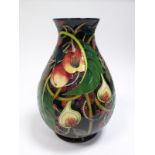 An Impressive Moorcroft Pottery Vase, tubelined and decorated with the Queens Choice design by