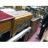 A Mid XX Century Camphor Chest, with a deep relief carved decoration figures within a landscape,