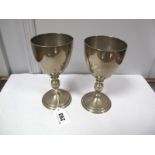 A Pair of Hallmarked Silver Goblets, Garrard & Co, London 1992, each of plain design, on knopped