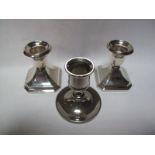 A Pair of Silver Hallmarked Squat Candlesticks, Chester 1938, the base of canted square section, (