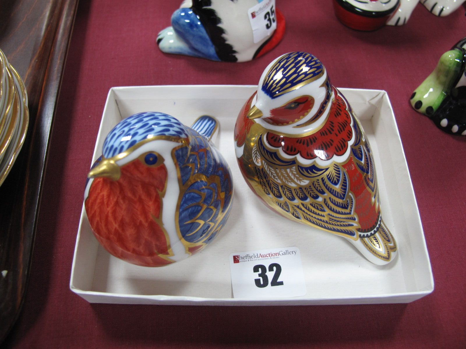 Two Royal Crown Derby China Paperweights, as "a robin" and "a chaffinch", both 6.5cms high, but