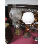 An Early XX Century Oil Lamp, with pierced gilt metal base, clear well, and an oak lamp with white