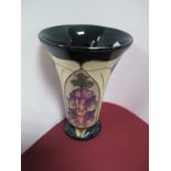 A Moorcroft Vase, of trumpet form and decorated in the Foxglove design by Kerry Goodwin, impressed