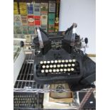 A 1920's Oliver Typewriter, with cover.