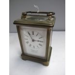 An Early XX Century French Brass Carriage Clock, (damages), with enamel dial signed "Alex Jones & Co