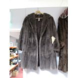 A Dyed Flank Musquash Wrap Coat, three-quarter length, in grey, with original purchase invoice  (