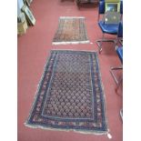 A Middle Eastern Rug, with all over hexagonal motifs on deep blue ground, 147 x 92cms, another