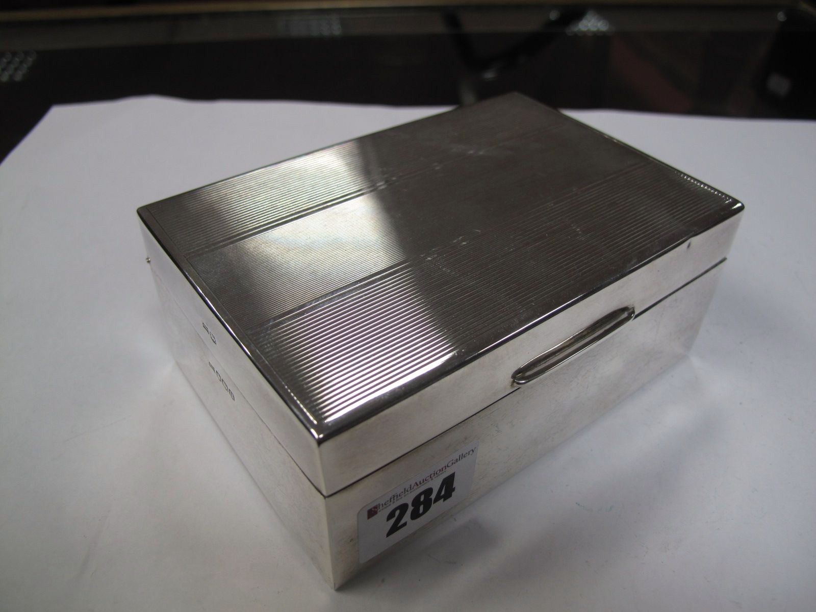 A Hallmarked Silver Cigarette Box, Walker & Hall, Sheffield 1962, of rectangular form with engine