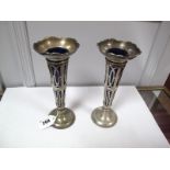A Pair of Hallmarked Silver Spill Vases, of openwork design, with blue glass liner, 19.5cms high.