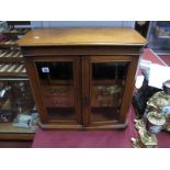 An Edwardian Oak Presentation Smokers Cabinet, of rectangular form with canted front angles, two