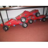 Three C. 1970 Childs Sit On Four Wheel Racing Cars. All chain driven, moulded plastic. All would