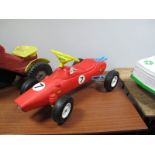 A Circa 1970's Childs Ride on Plastic Race Car, approximately 80cms long, appears complete with