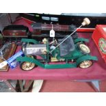 A Mamod Steam Car. Finished in green and gold. Complete with burner. Appears unfired.