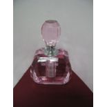 A Pink Tinted Crystal Scent Bottle, with faceted stopper.