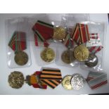 Eight Russian Medals and Commemorative Medals, all appear to be from the communist era. All