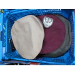 A Mid XX Century British Military Beret, an American military peak cap, a small quantity of cloth