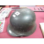 A 1940 Pattern German Helmet. No decals, replacement liner.