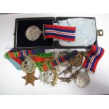 Four WWII Medals, two War Medals, Defence Medal, 1939-45 Star, plus a small quantity of hat badges.