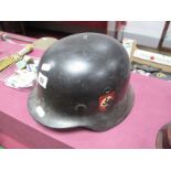 A 1940 Pattern German Helmet. Correct liner. Painted with later decal.