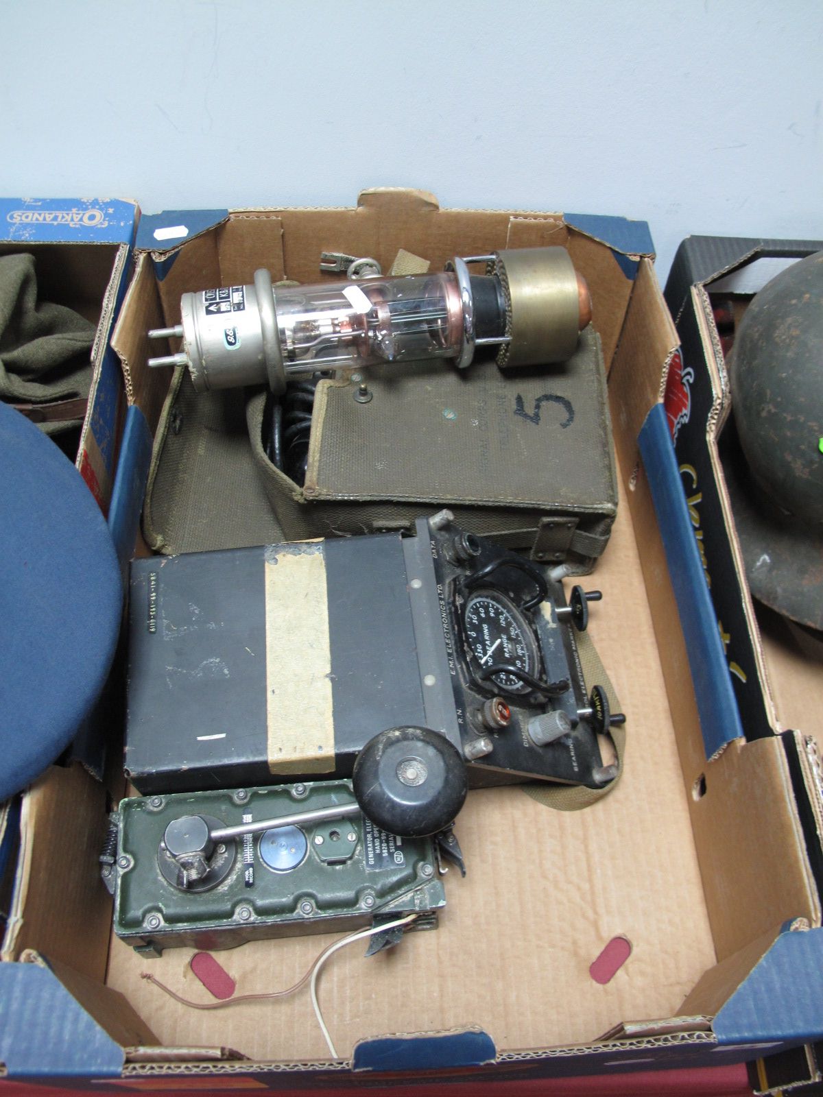 A Mid XX Century British Military Range Finder, a hand held generator and GEC military valve and