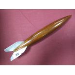 A Mid XX Century Desk Top Model of a V2 Rocket, made of wood with aluminium tail pieces, with