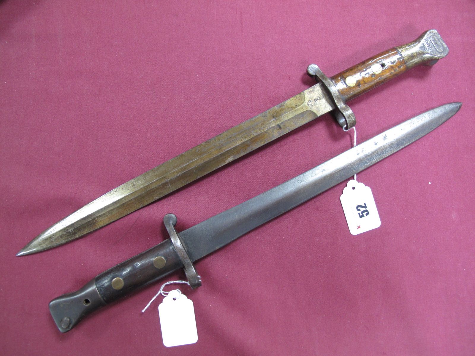 Two 1888 Pattern Bayonets, a MkI and a MkII, both showing signs of wear. MkII blade may have been