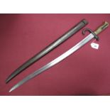 A Late XIX Century French Sabre Bayonet, with ribbed brass grip, No.97463, with scabbard. Scabbard