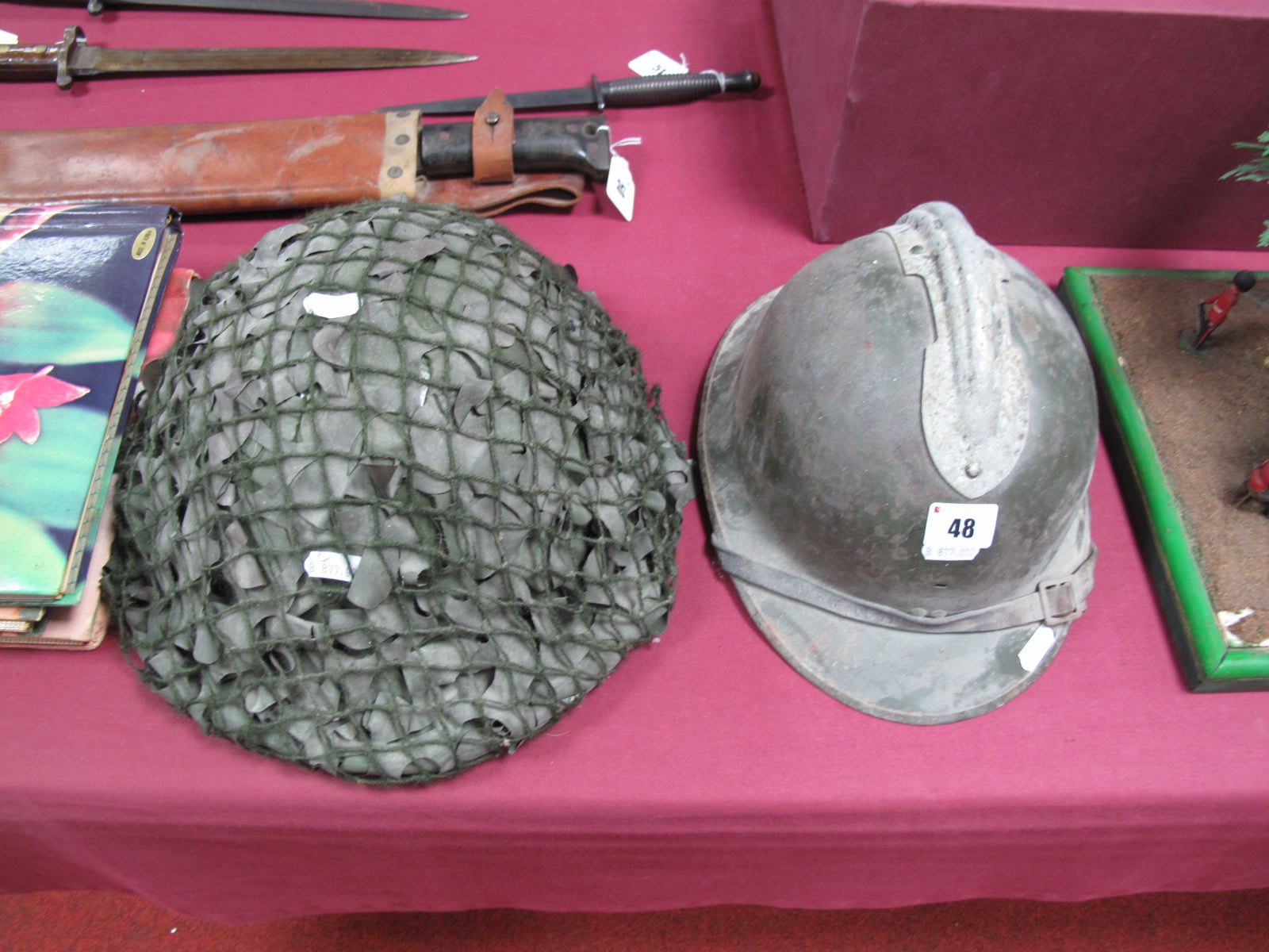 A First Half of XX Century French Infantry Steel Helmet, missing liner, plus a late "Tommy" helmet