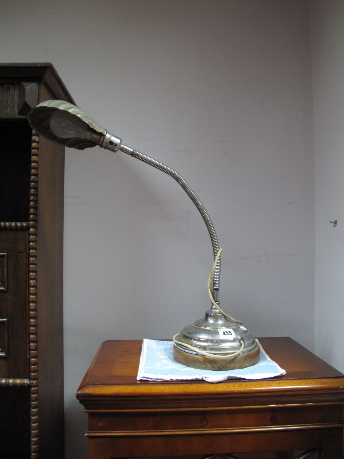 A 1920's Chrome Desk Top Table Lamp, with a chrome shade, on a circular base.