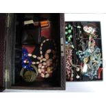 Assorted Costume Jewellery, including brooches, beads, bangle etc, contained in an old jewellery