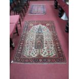 A Middle Eastern Rug, central depiction of the tree of life, stylised floral motifs on a cream