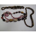 Two Polished Tigers Eye Graduated Bead Necklaces, each to clasp stamped "925", together with two